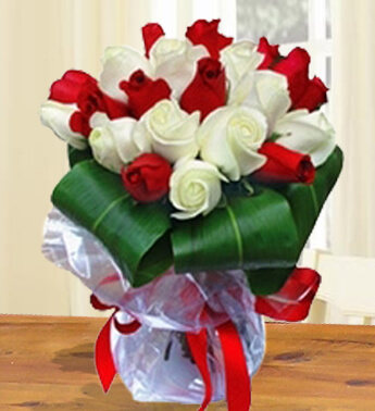 Bunch of 10 Stems Of Red Roses & 10 Stems Of White Roses with fillers and green big leaves in nice wrapping Simple Beauty