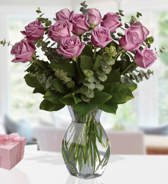12 Stems of Purple Roses with green fillers in a Glass Vase Sugar Roses