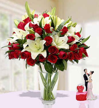 5 stems of White Asiatic Lilies and 20 stems of Red Roses in a Glass Vase Memorable Moments