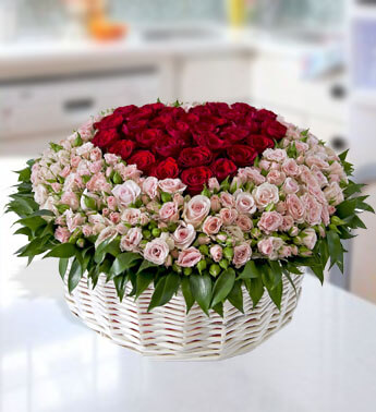 Heart shape basket arrangement 50 Red Roses (Big head) and 40 stems of Pink spray Roses with fillers. True Romance