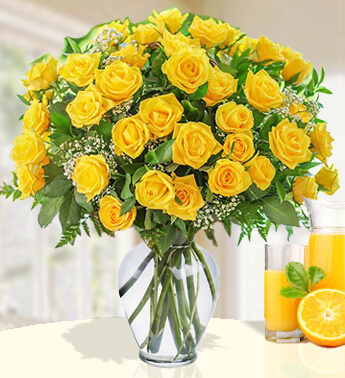 36 Yellow Roses with fillers in a glass vase. Sunny Day pitcher