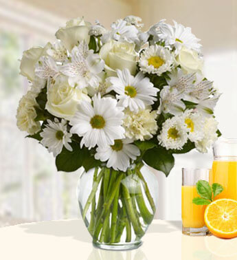 5 White Rose , 5 White Carnation , 3 stems of White Astromeria , 3 stems of White Chrysanthemums in Glass vase (One side round arrangement) Serenity Bouquet