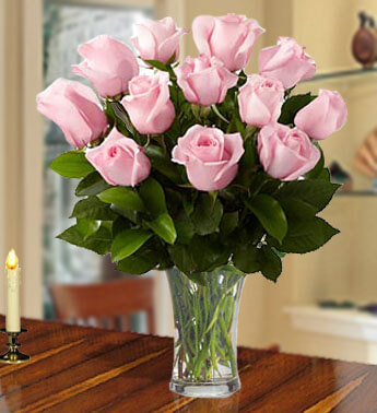 Arrangement of 12 stems of Pink Roses with fillers in a glass vase.. Graceful Pink