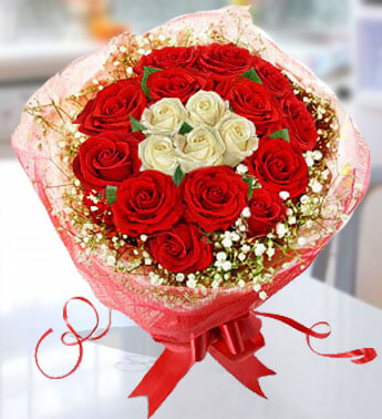Bunch of 12 stems of Red Roses & 5 stems of White Roses with fillers in a nice wrapping paper. Stunning Beauty