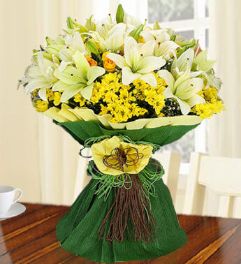 Bunch of 6 stems of Yellow Roses,6 stems of Yellow Chrysanthemums and 7 stems of White Lilies in a nice wrapping. Flawless Blossoms