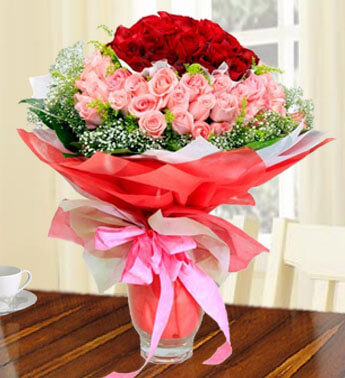 Bunch of 50 Pink and 49 Red Roses with fillers in a nice wrapping. Strong Feelings