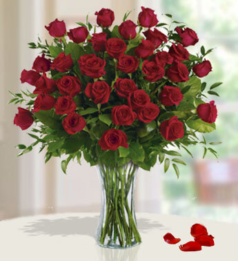 36 Red Roses with fillers in a glass vase. Breathtaking Roses