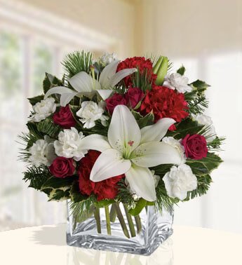 1 stems of White Lilies, 10 White Carnation, 4 Red Rose, 3 Red Carnation in a cube vase. (Arrangement ) Holiday Bouquet