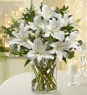 20 stems of White Lilies in a glass vase. Eternal Light
