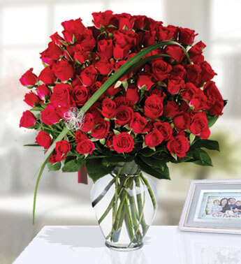 45 Red Rose and 25 stems Red Spray Roses with fillers in a glass vase.(One side round arrangement) Unforgettable Red