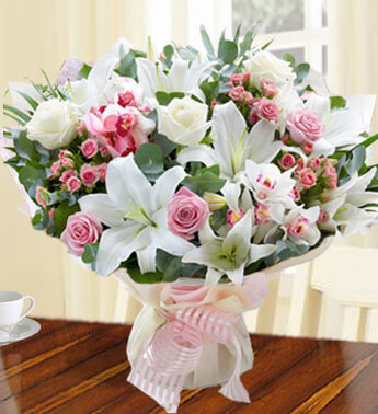 Bunch of 10 stems of Pink Spray Rose, 5 stems of White Lily, 7 Pink Rose, 5 White Rose with fillers in a nice wrapping. Heavenly Gift