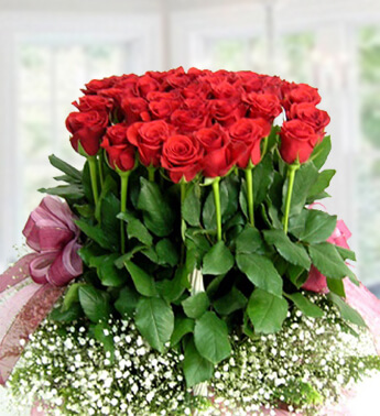 Basket arrangement of 36 Red Roses with white fillers. Touch Of Heart