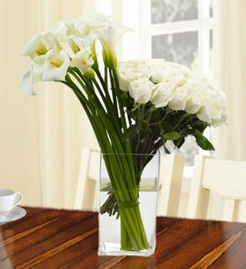 10 Calla Lilies and 24 White Roses in a glass vase.(as Image) Perfect Pair