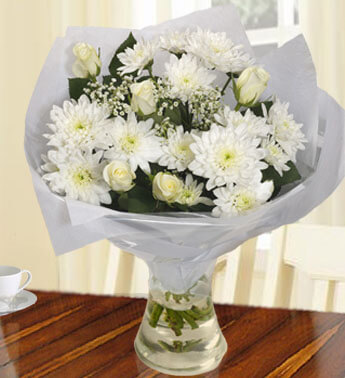Bunch of 4 stems of White Chrysanthemums and 6 White Roses in a nice wrapping. Pure White Bouquet