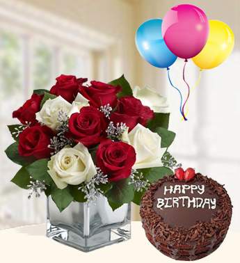 Bunch of 7 Red and 4 White Roses with fillers and nice wrapping , 1 kg Chocolate Cake , 3 Latex Balloon Truly Magical Combo