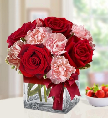 Arrangement of 4 Red Roses 8 Pink Carnations in cube glass vase Loved One